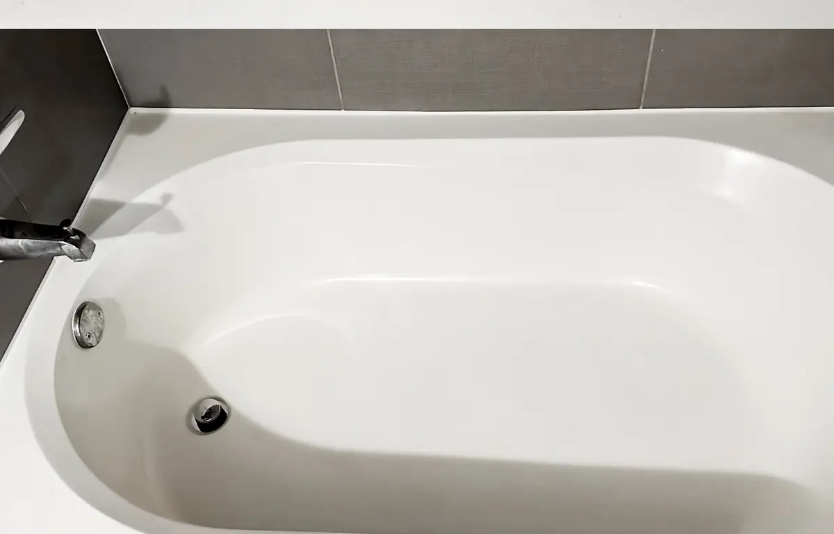 The same bathtub gleaming white after a Clean My Mess visit
