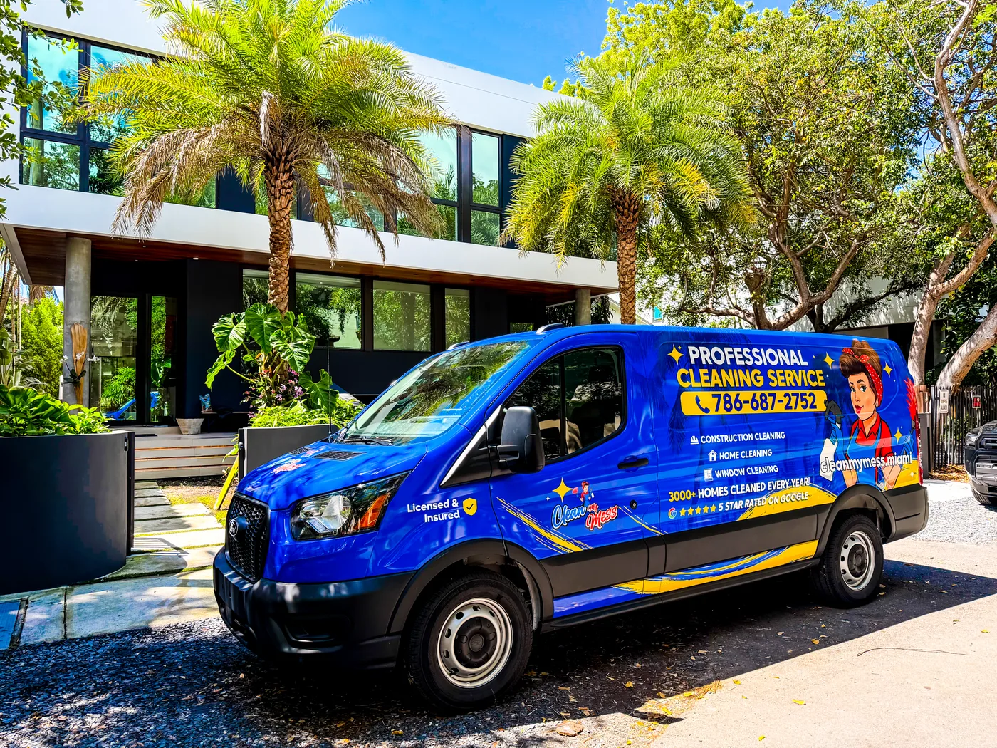 Clean My Mess branded van in front of a Miami home
