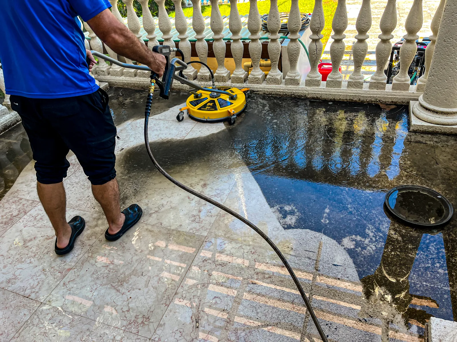 Pressure washing restoring an outdoor surface at a Miami home