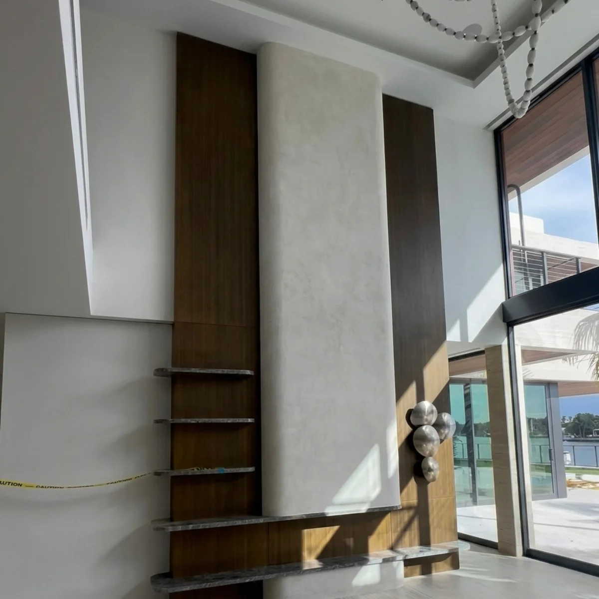 Double-height waterfront villa interior after post-construction cleaning